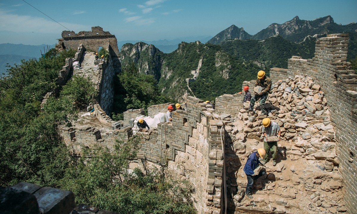 Figure 3. Workers Repair the Damaged Building at the Jiankou Section of the Great Wall